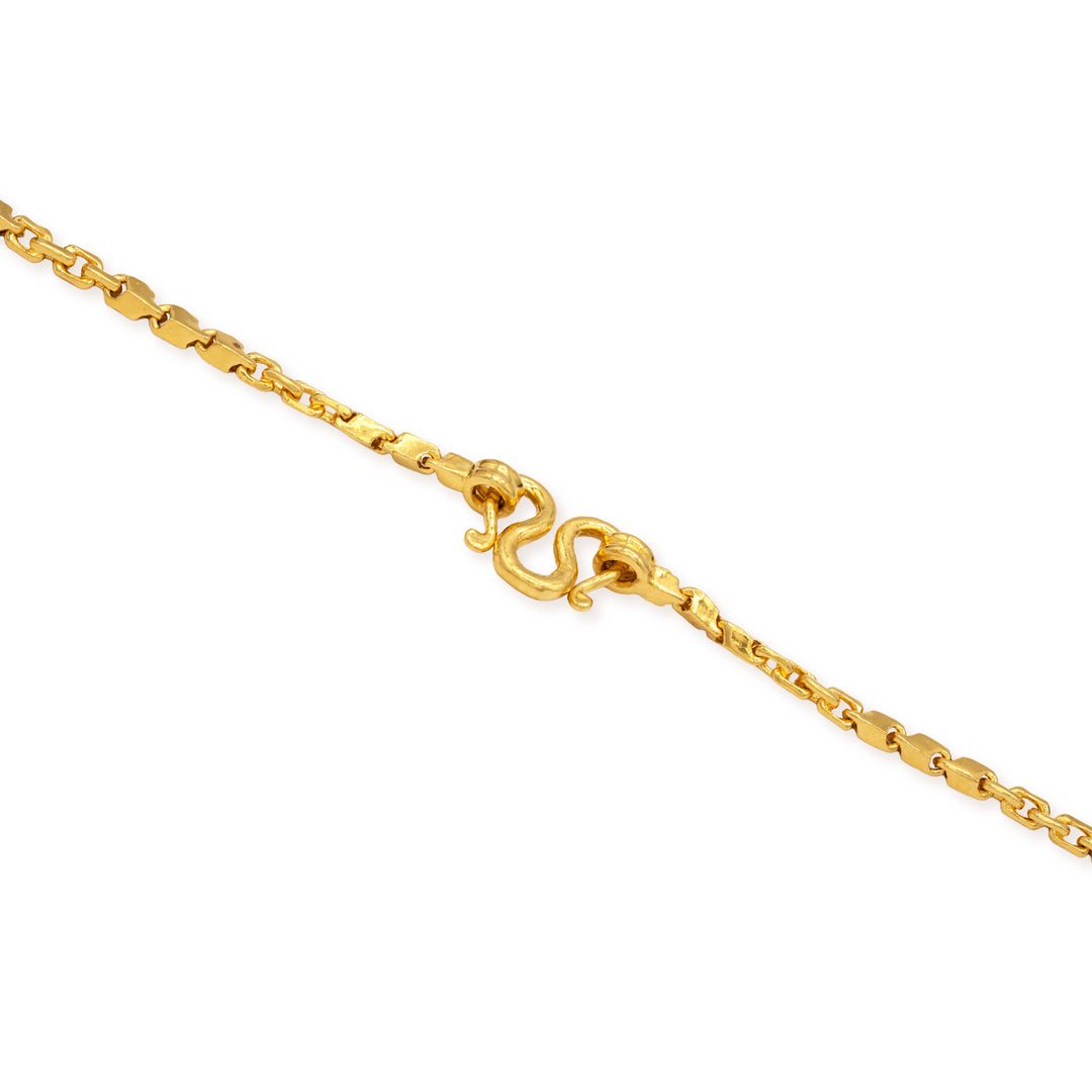 Close-up of secure M lock clasp on 24k gold fancy link chain necklace