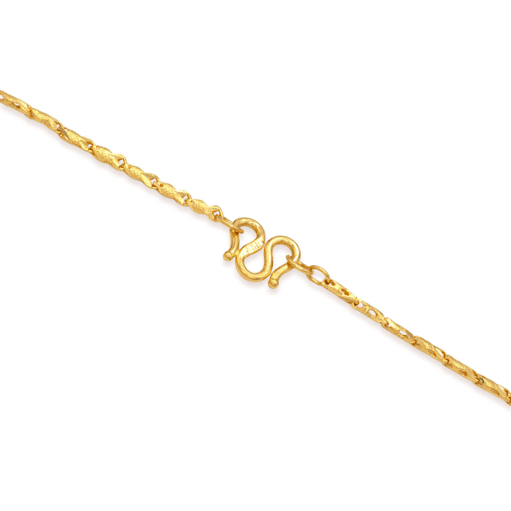 Close-up of m clasp on a 24k gold fish link chain