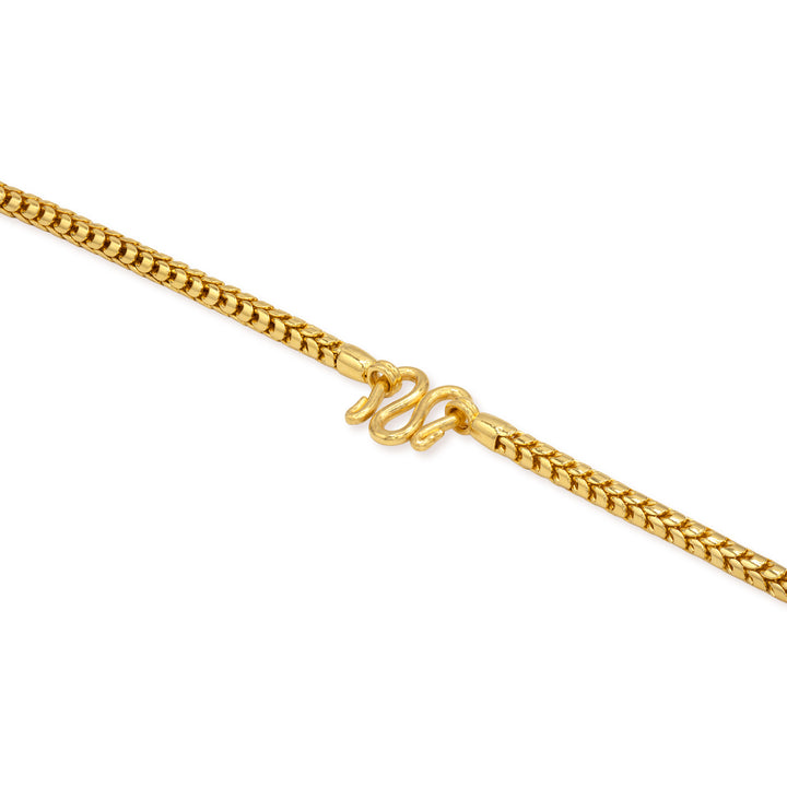Close-up of secure M lock clasp on 24k gold Franco chain necklace