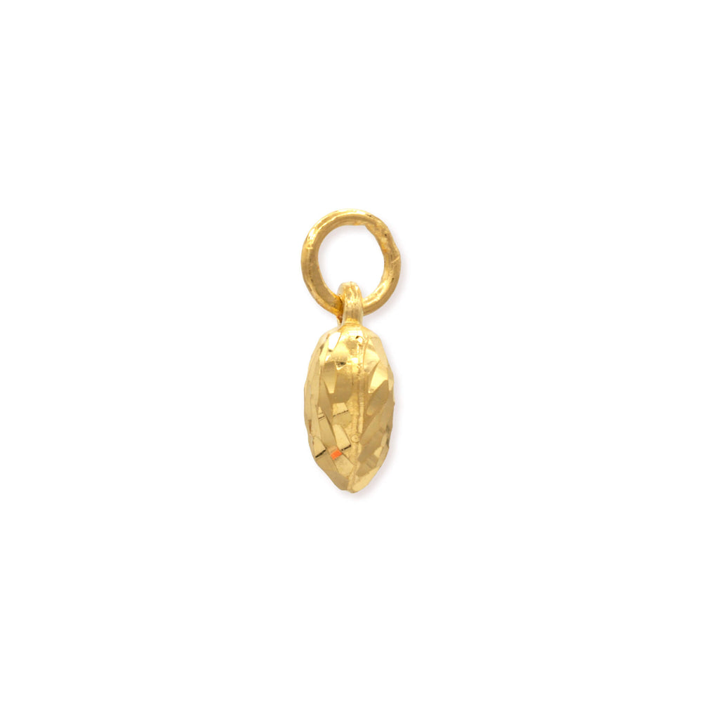 Side profile of 24k gold heart mini pendant showing dimensional depth, textured detailing, and bail attachment