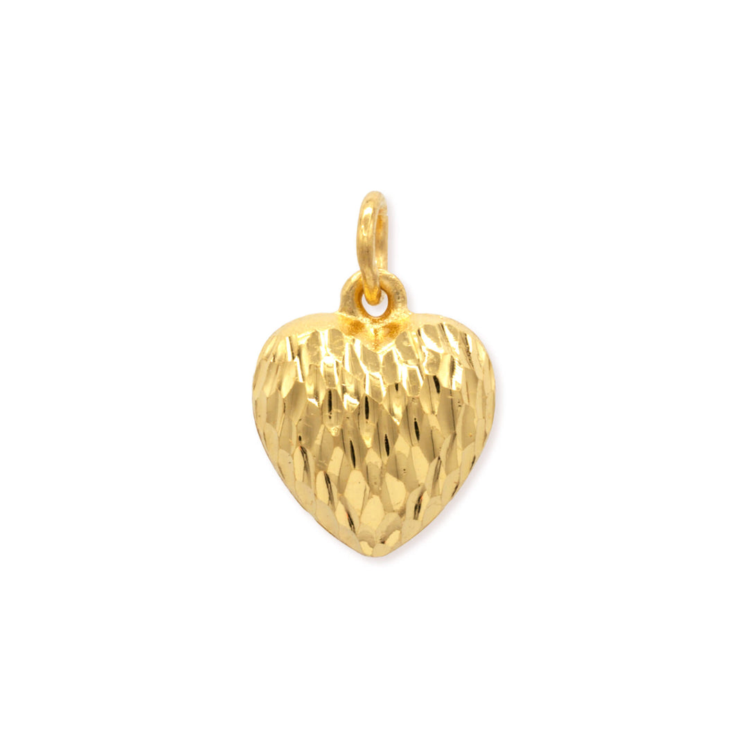 24k gold heart pendant with diamond-cut textured surface and faceted geometric patterns on white background