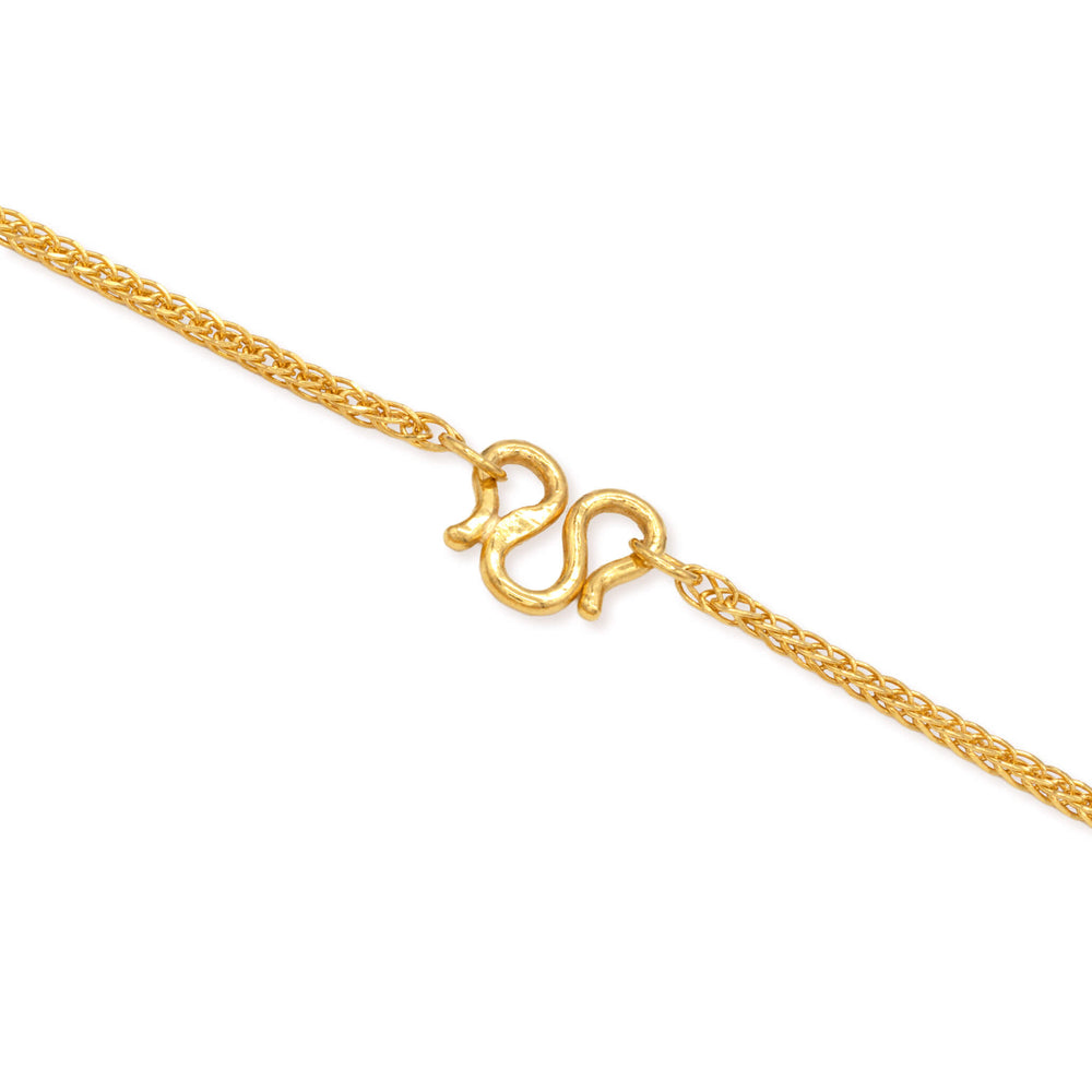 Close-up of M clasp on a 1mm 24k gold wheat chain