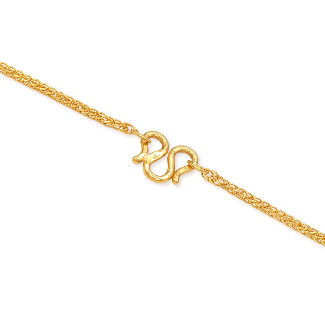 Close-up of M clasp on a 1mm 24k gold wheat chain