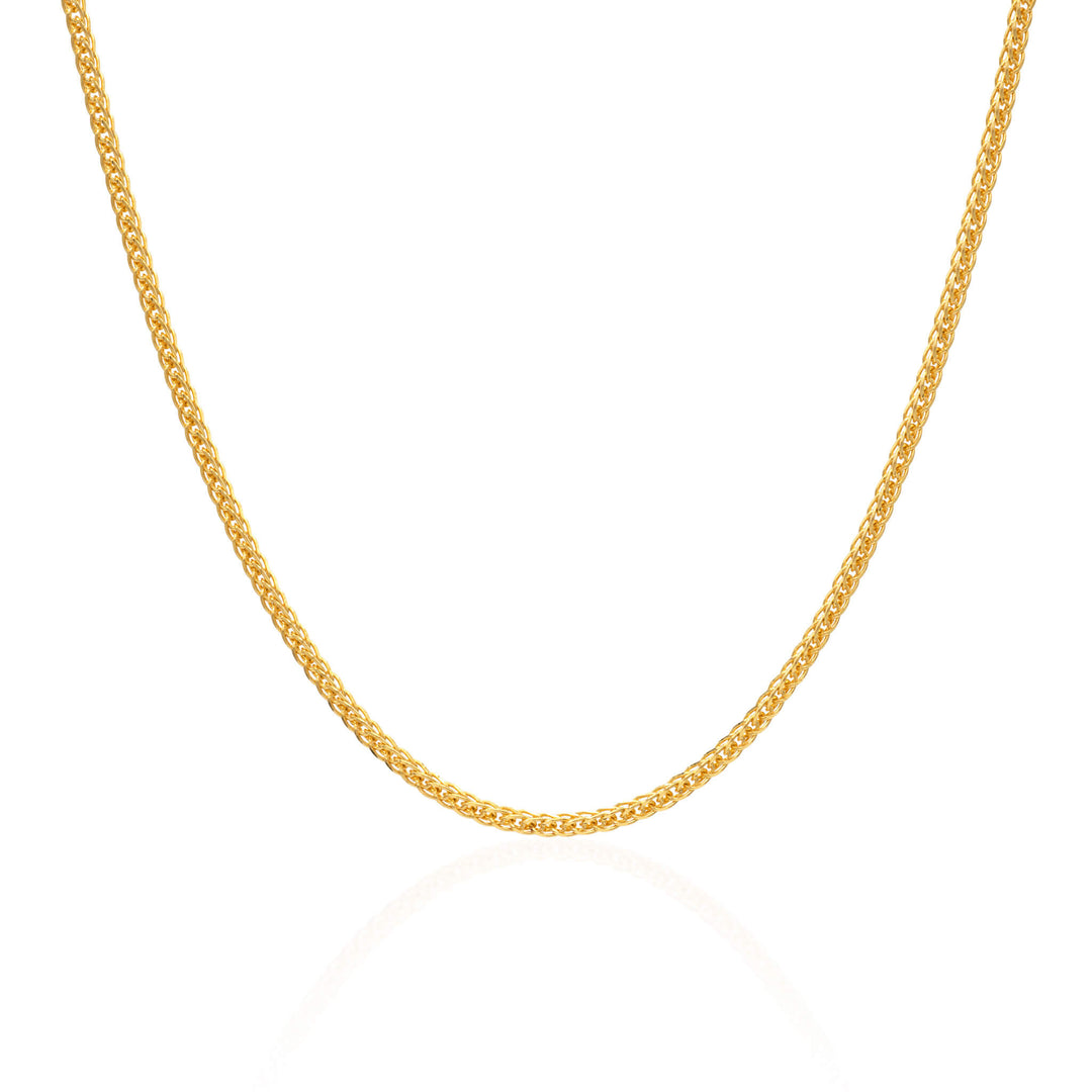 Pure gold 1mm wheat chain on a white background 